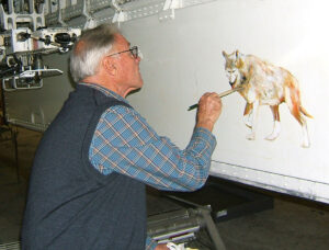 Robert Moore originally painting the image of the Lone Wolf on the F-117 in 2006. 