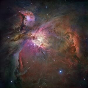 This dramatic image offers a peek inside a cavern of roiling dust and gas where thousands of stars are forming. The image, taken by the Advanced Camera for Surveys (ACS) aboard NASA/ESA Hubble Space Telescope, represents the sharpest view ever taken of this region, called the Orion Nebula. More than 3,000 stars of various sizes appear in this image. Some of them have never been seen in visible light. These stars reside in a dramatic dust-and-gas landscape of plateaus, mountains, and valleys that are reminiscent of the Grand Canyon. The Orion Nebula is a picture book of star formation, from the massive, young stars that are shaping the nebula to the pillars of dense gas that may be the homes of budding stars. The bright central region is the home of the four heftiest stars in the nebula. The stars are called the Trapezium because they are arranged in a trapezoid pattern. Ultraviolet light unleashed by these stars is carving a cavity in the nebula and disrupting the growth of hundreds of smaller stars. Located near the Trapezium stars are stars still young enough to have disks of material encircling them. These disks are called protoplanetary disks or "proplyds" and are too small to see clearly in this image. The disks are the building blocks of solar systems. The bright glow at upper left is from M43, a small region being shaped by a massive, young star's ultraviolet light. Astronomers call the region a miniature Orion Nebula because only one star is sculpting the landscape. The Orion Nebula has four such stars. Next to M43 are dense, dark pillars of dust and gas that point toward the Trapezium. These pillars are resisting erosion from the Trapezium's intense ultraviolet light. The glowing region on the right reveals arcs and bubbles formed when stellar winds - streams of charged particles ejected from the Trapezium stars - collide with material. The faint red stars near the bottom are the myriad brown dwarfs that Hubble spied for the first time in the nebula in visible light. Sometimes called "failed stars," brown dwarfs are cool objects that are too small to be ordinary stars because they cannot sustain nuclear fusion in their cores the way our Sun does. The dark red column, below, left, shows an illuminated edge of the cavity wall. The Orion Nebula is 1,500 light-years away, the nearest star-forming region to Earth. Astronomers used 520 Hubble images, taken in five colours, to make this picture. They also added ground-based photos to fill out the nebula. The ACS mosaic covers approximately the apparent angular size of the full moon. The Orion observations were taken between 2004 and 2005.